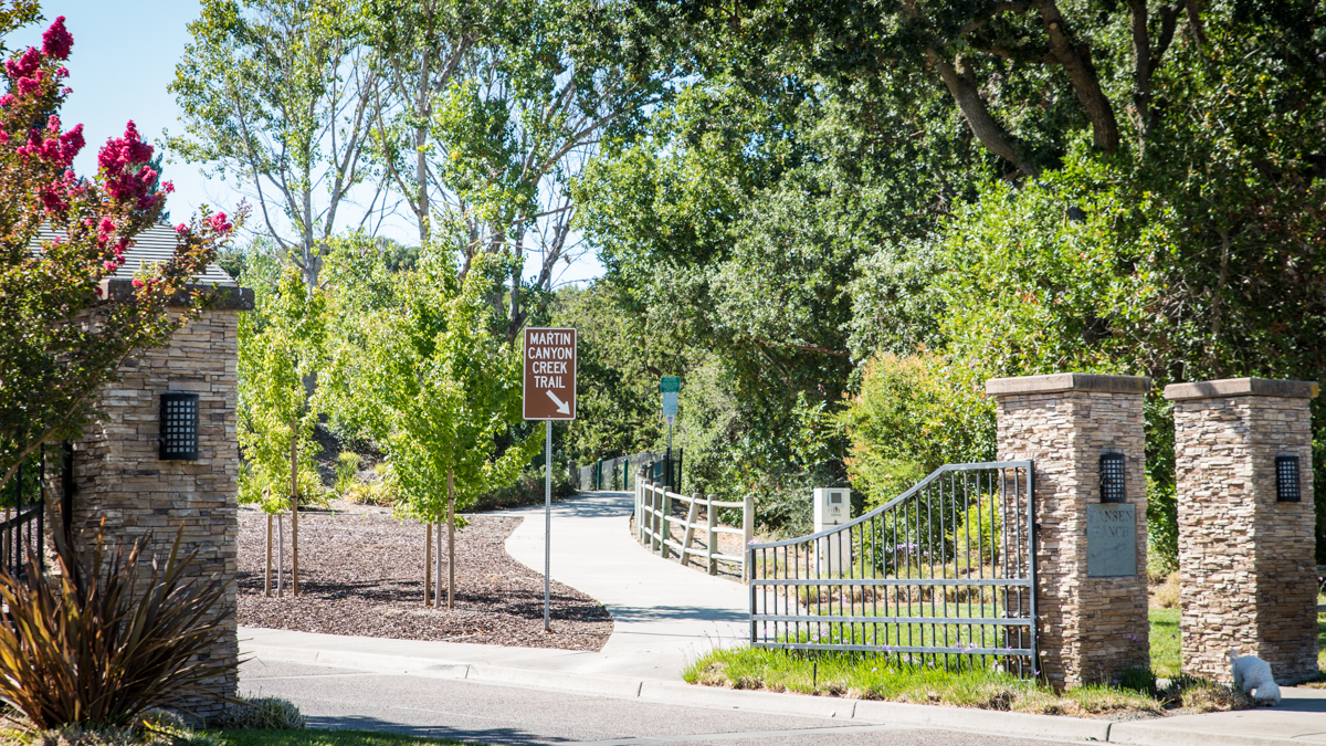 The Martin Canyon Creek Trail begins just inside the stone gates of the Hansen Ranch neighborhood.