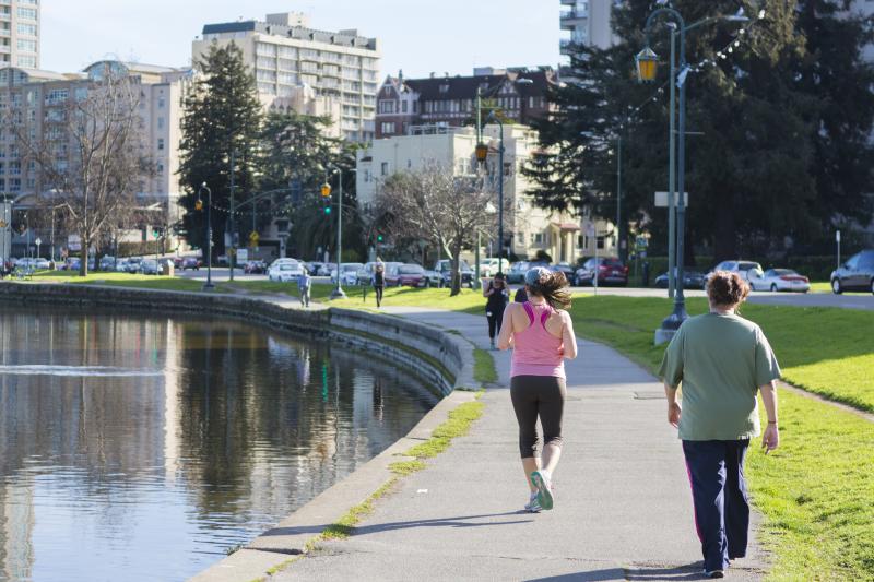 You can find walkers and joggers around Lake Merritt in downtown Oakland.
