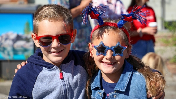 Kids smiling at the Orinda 4th of July Parade. Photo courtesy of Orinda Association. 