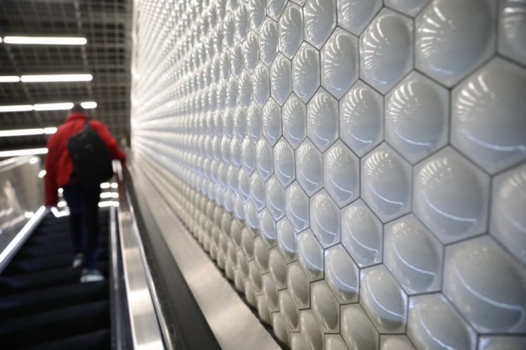 BART's bubble tiles are seen on a wall at Powell St. Station. 