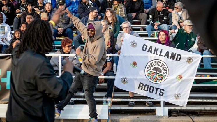 Fans at an Oakland Roots game. Photo courtesy of Oaklandside. Credit: Amir Aziz