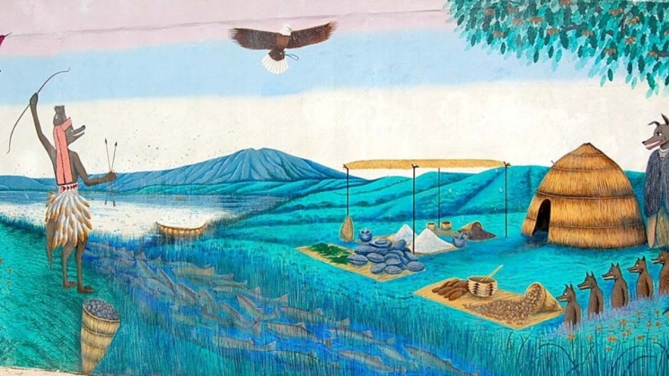 painted mural depicting the area before colonization