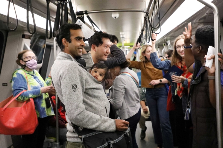 A photo from One Book One BART’s 2022 ”train read-in,” a book club on a moving, in-service train. 