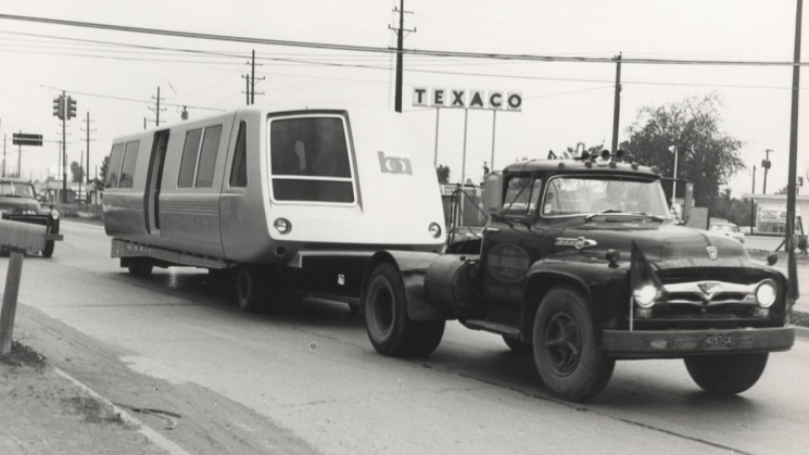 Half of the final BART car prototype traveling on a trailer to California in 1965. Photo courtesy of Sundberg-Ferar.