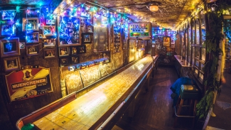 Experience Oakland charm with shuffleboard, cold beers and a friendly crowd at Kingfish Pub & Cafe. Photo courtesy of Visit Oakland.