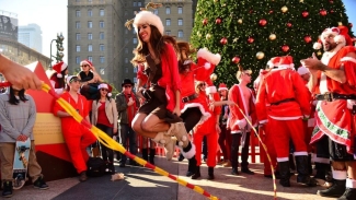 Don't forget your red coat and have fun at SantaCon! Photo courtesy of SantaCon. 