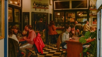 Enjoy natural wines and seasonal small plates at Snail Bar. Photo courtesy of Resy. 