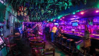You'll love this dive bar with pool tables, a jukebox and laid-back vibes at The Avenue. Photo courtesy of Visit Oakland.