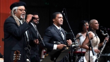 Juan de Marcos & Afro-Cuban All-Stars playing musical instruments