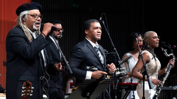 Juan de Marcos & Afro-Cuban All-Stars playing musical instruments