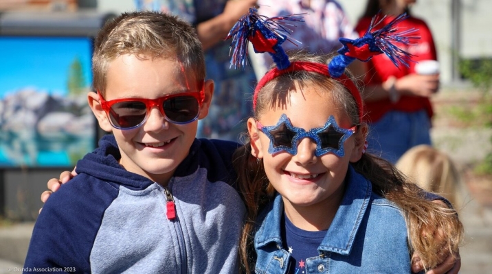 Kids smiling at the Orinda 4th of July Parade. Photo courtesy of Orinda Association. 