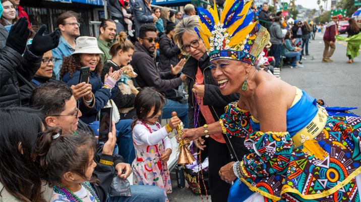 Dancer greeting kids at SF Carnaval